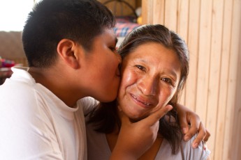 Boy Kissing Moma in Peru